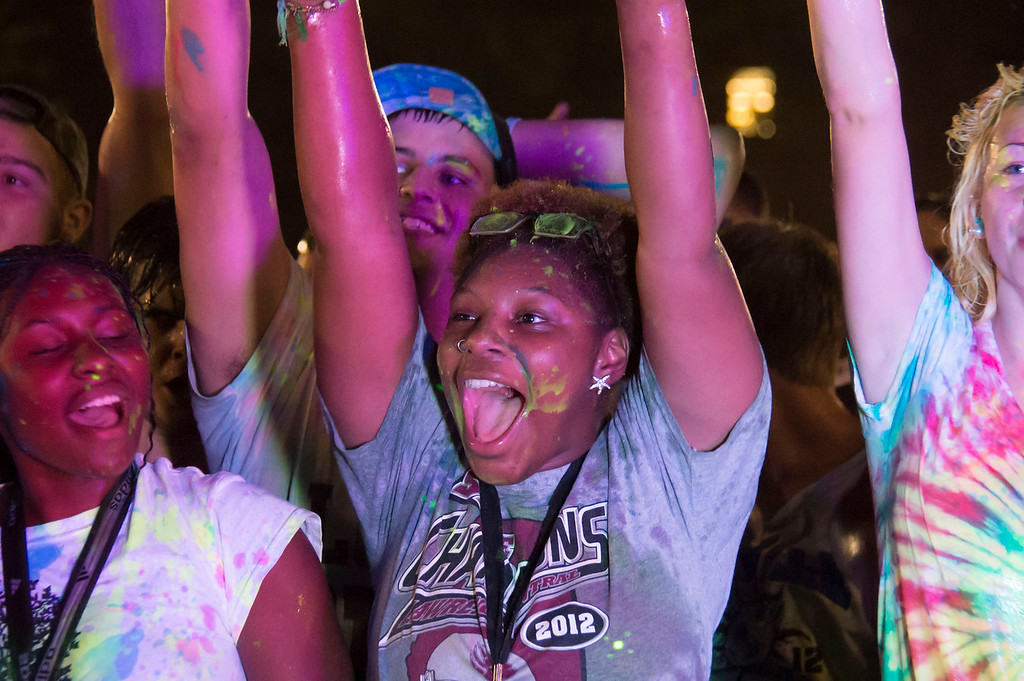 Students covered in paint cheering