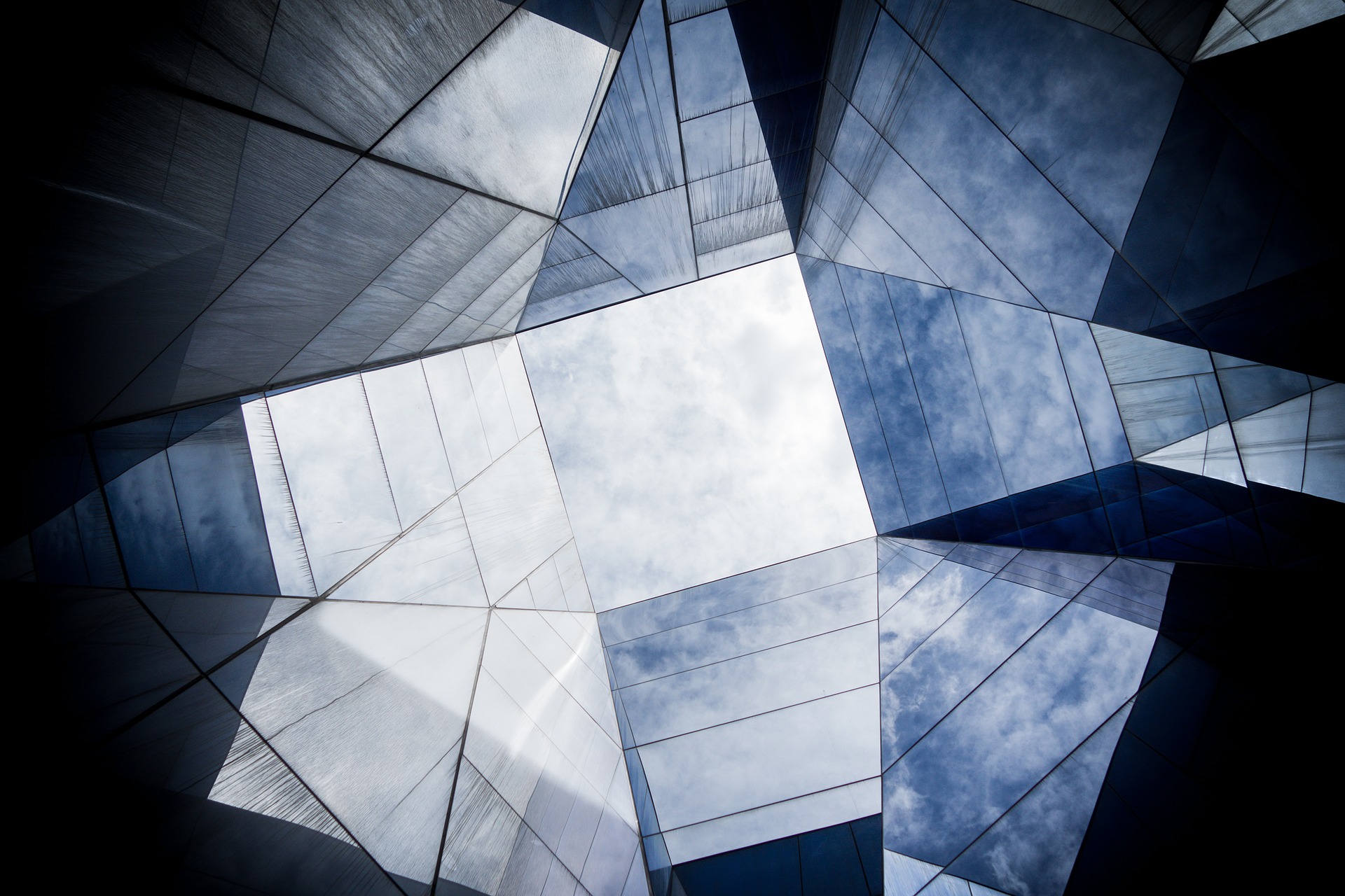 The top of a building made up of unusual shapes