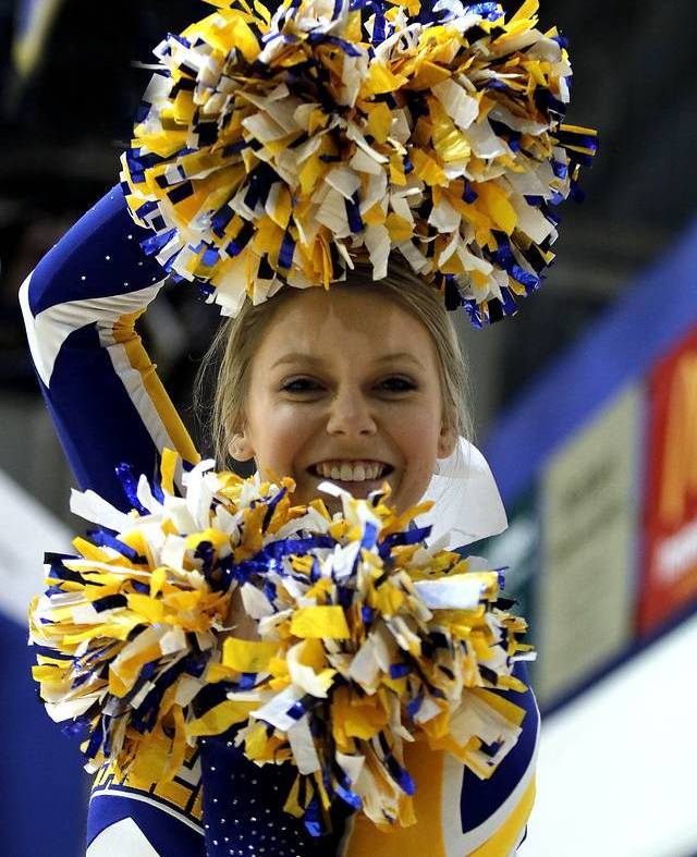Cheerleader with pom poms