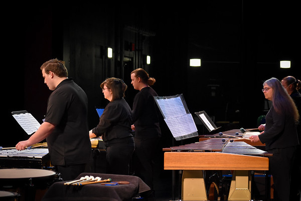 A group of music students and Professor Jackson playing a xylophone