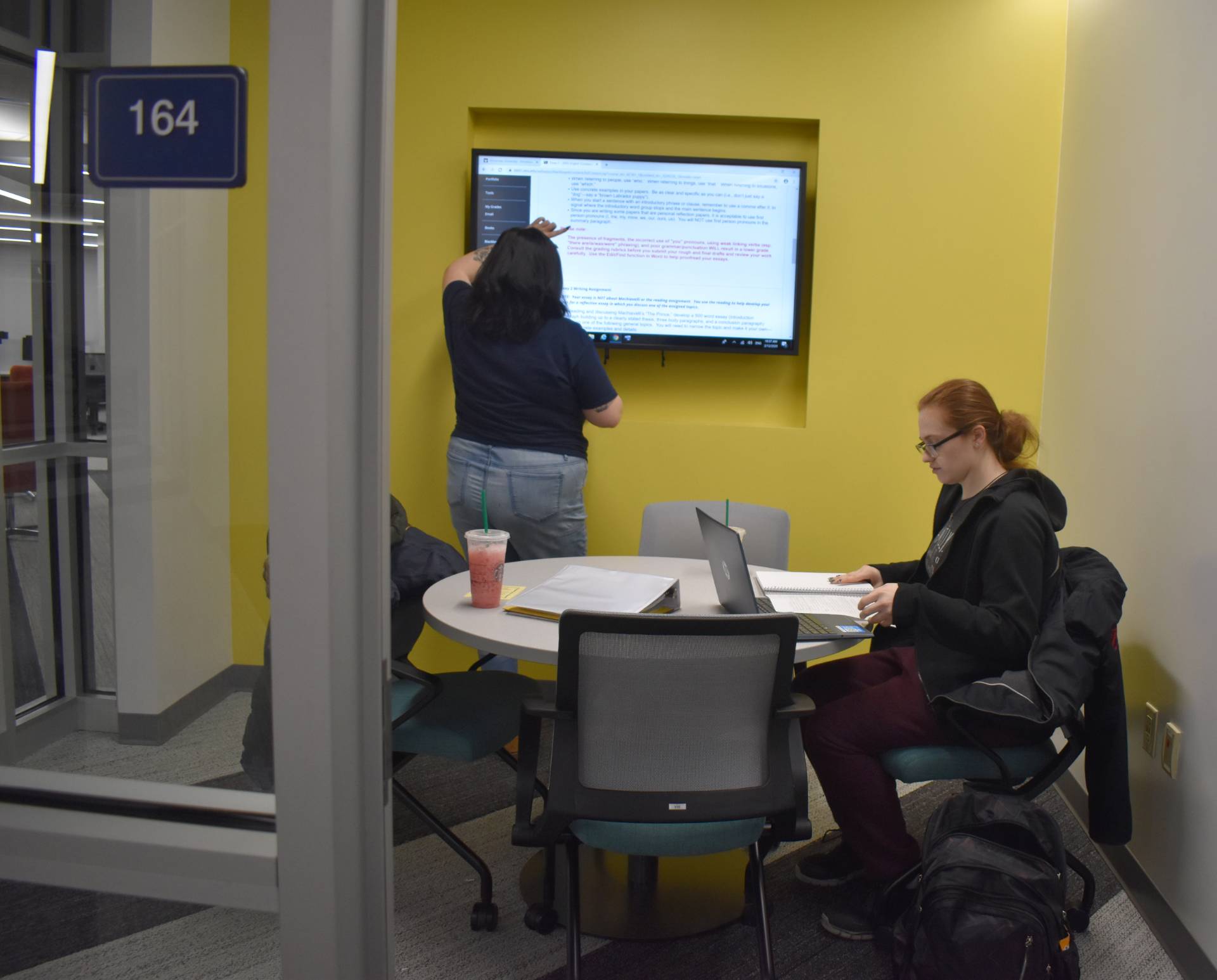 Two students sharing a study area in Shake Resource Center
