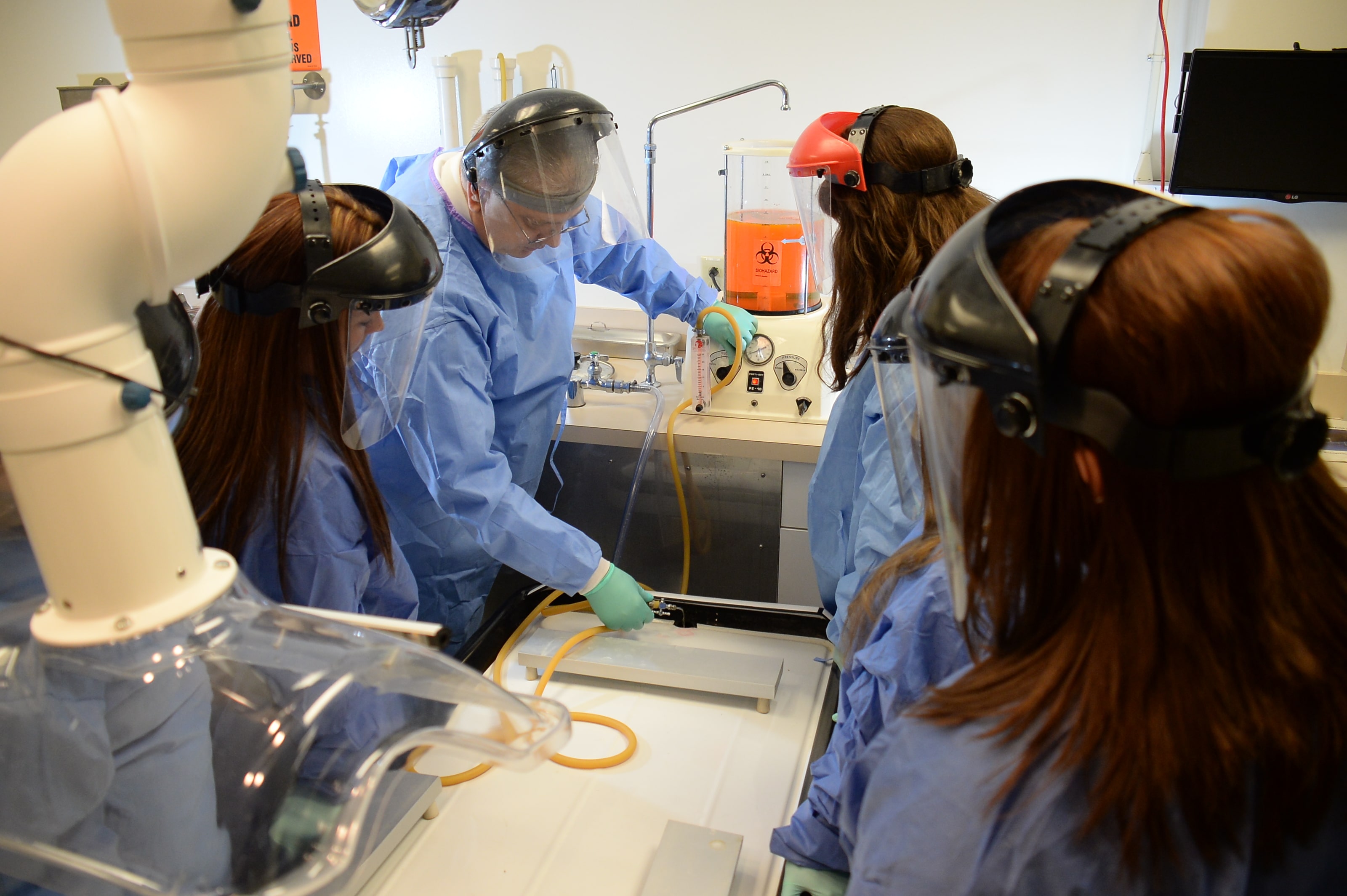 A surgery professor teaching his students