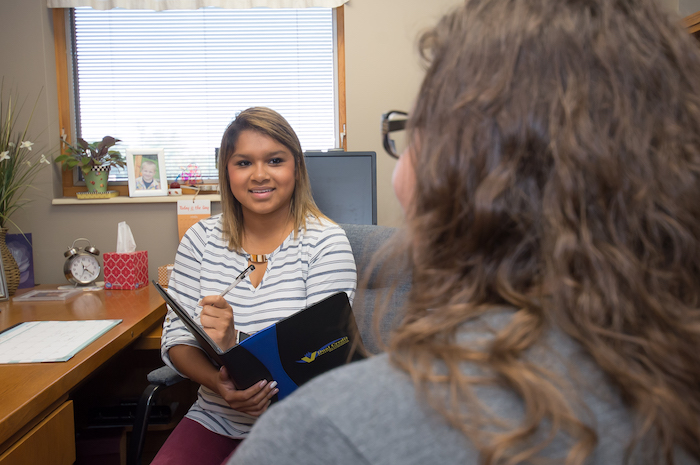 A hiring manager holding an interview in her office