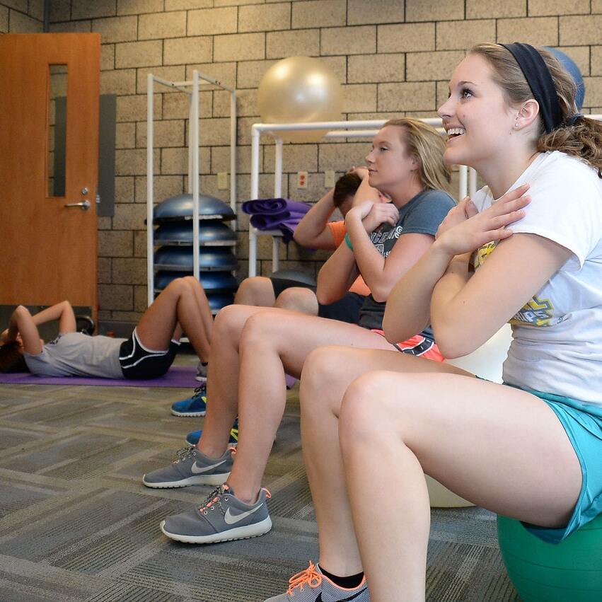 A group of students working out in the gym
