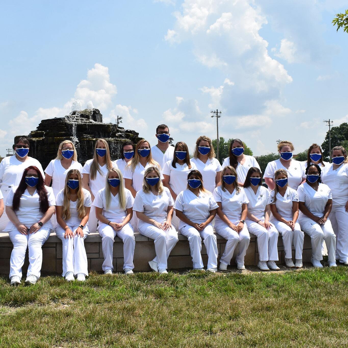 Nursing students posing for a photo in front of Updike Fountain