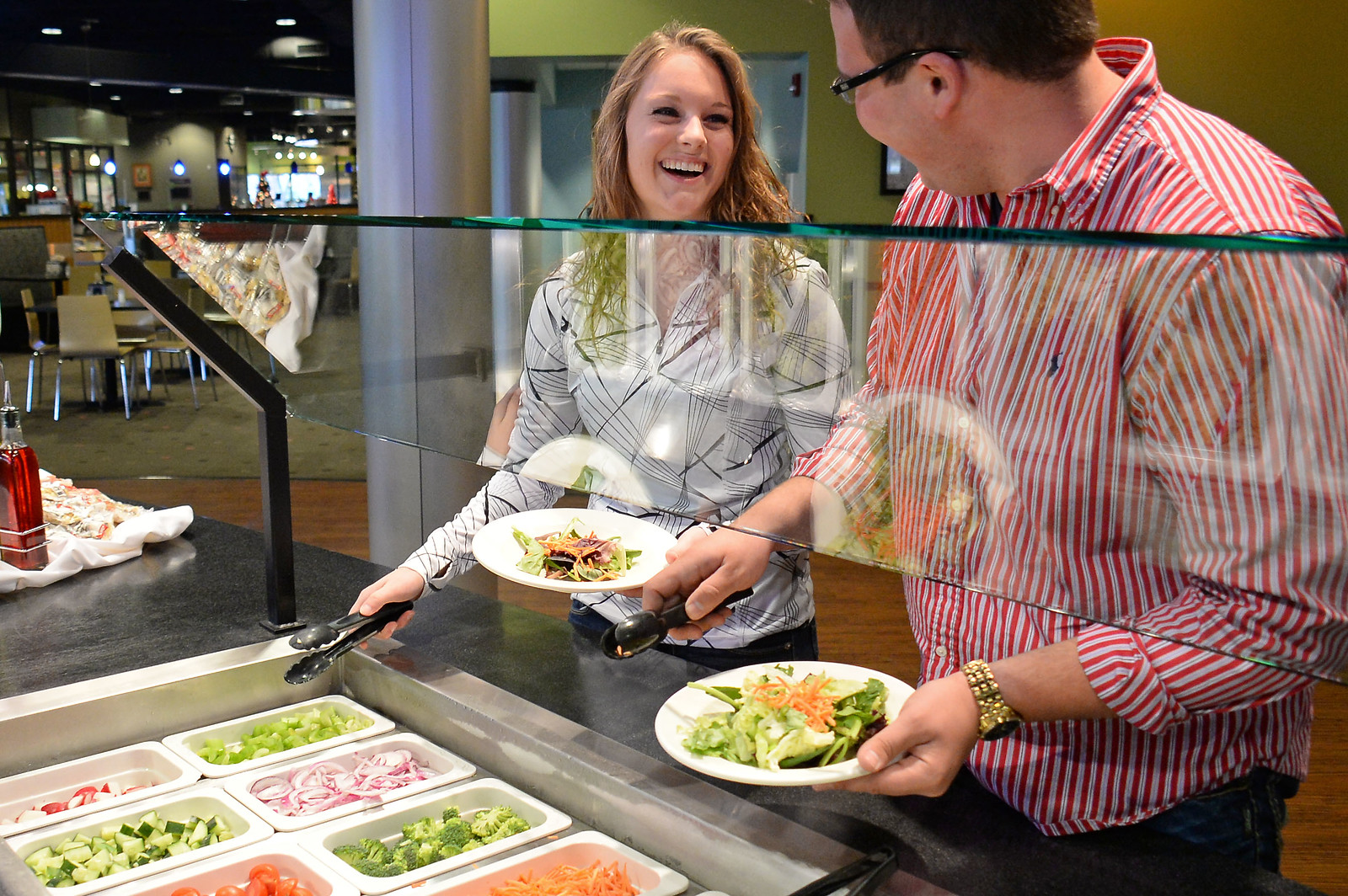 People enjoying the fresh buffet options at Tecumseh Dining Center