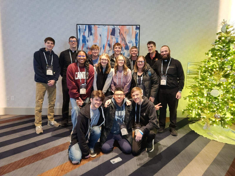 Blazer Catholic members posing for a photo at a conference