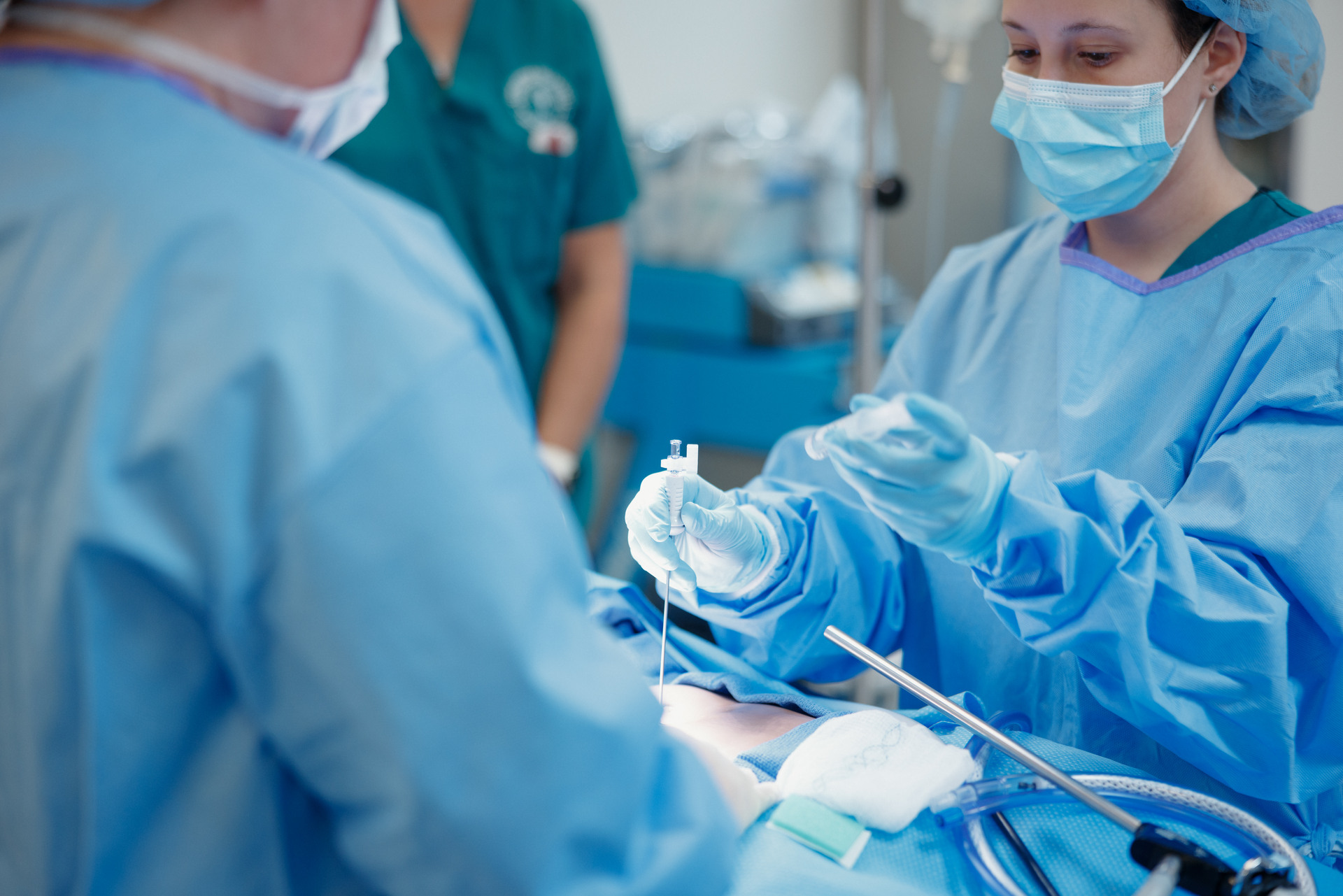Female surgery student with a training dummy