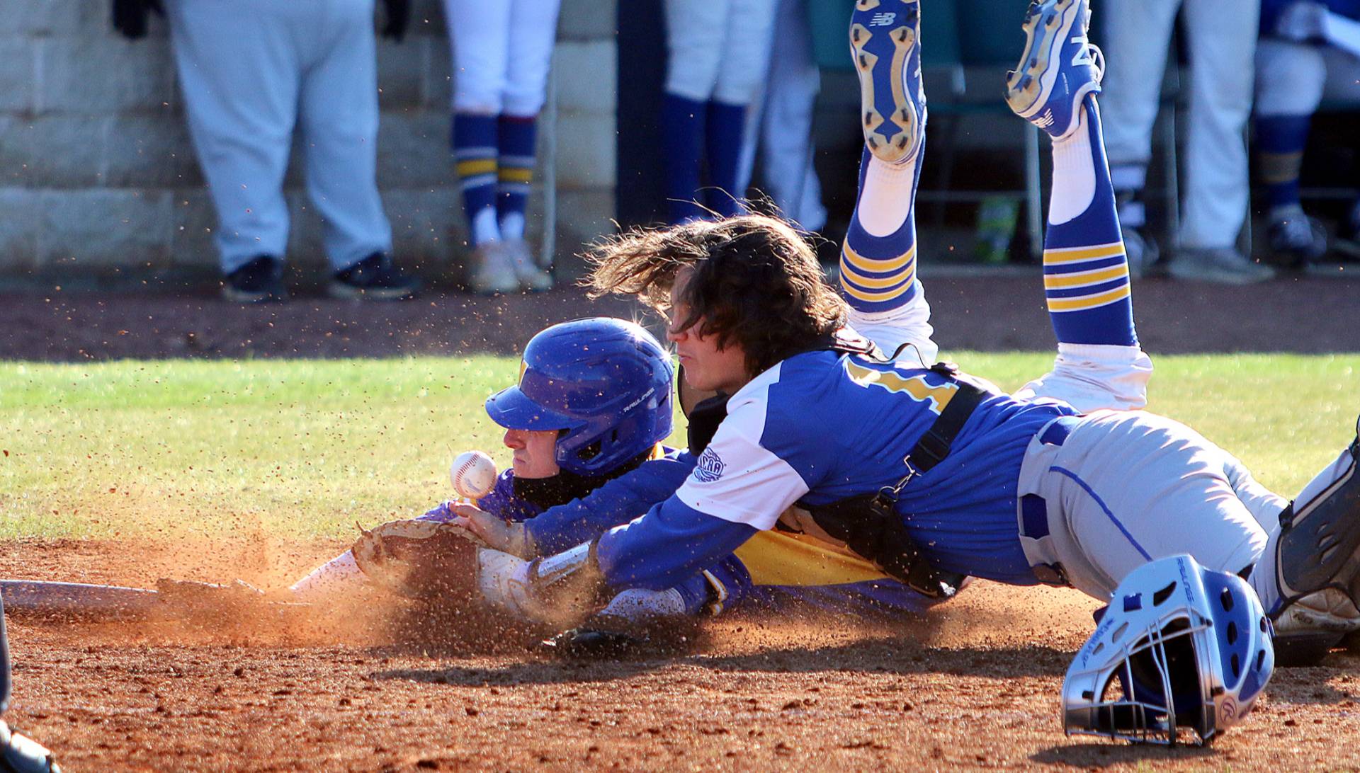 VU Athletics Baseball player sliding home