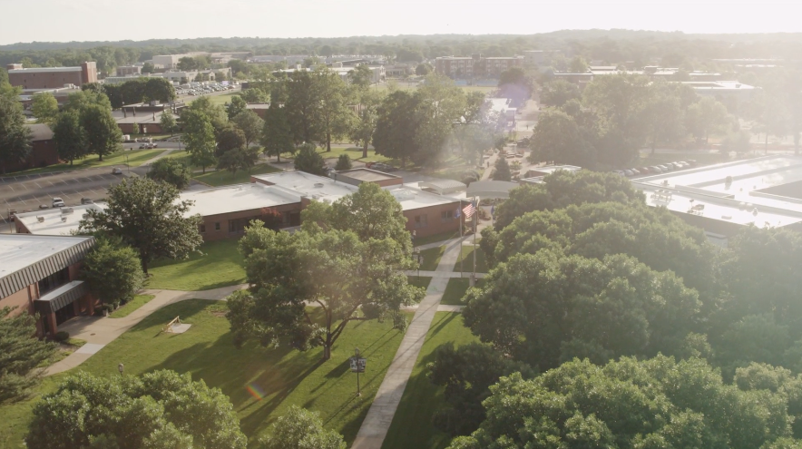 An image of the campus from above specifically looking down on the admissions building.