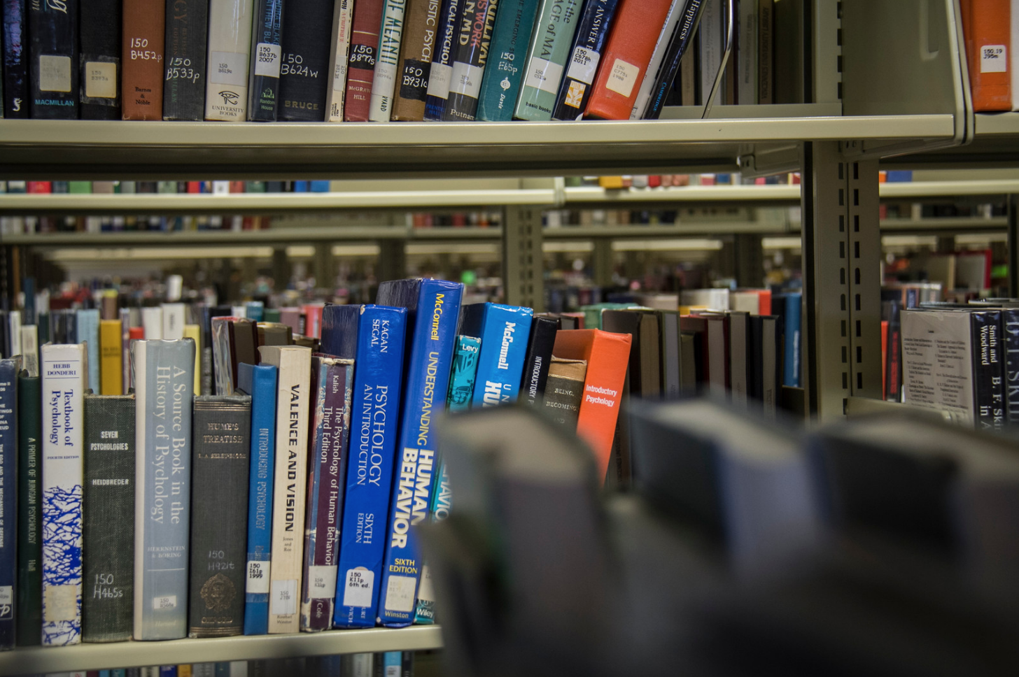 Books on a shelf inside a library