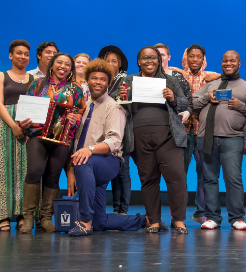 Talent show participants gather on stage